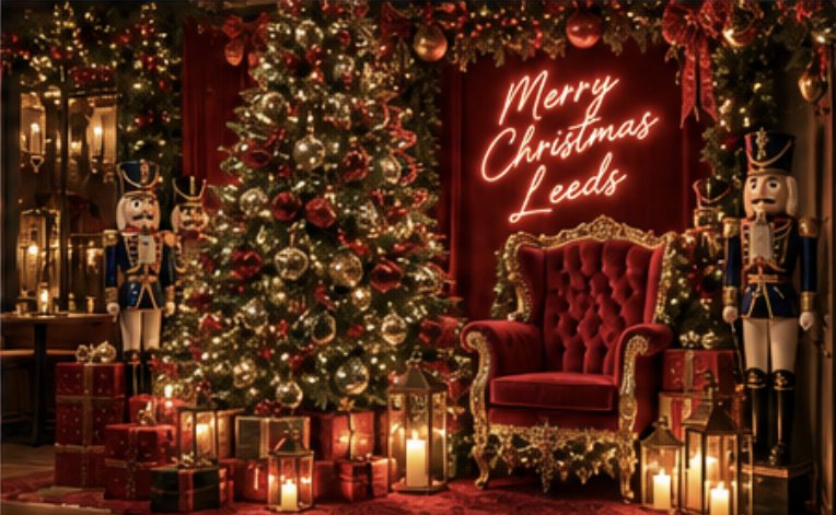 Red velvet chair beside the big tree and a neon Merry Christmas Leeds sign